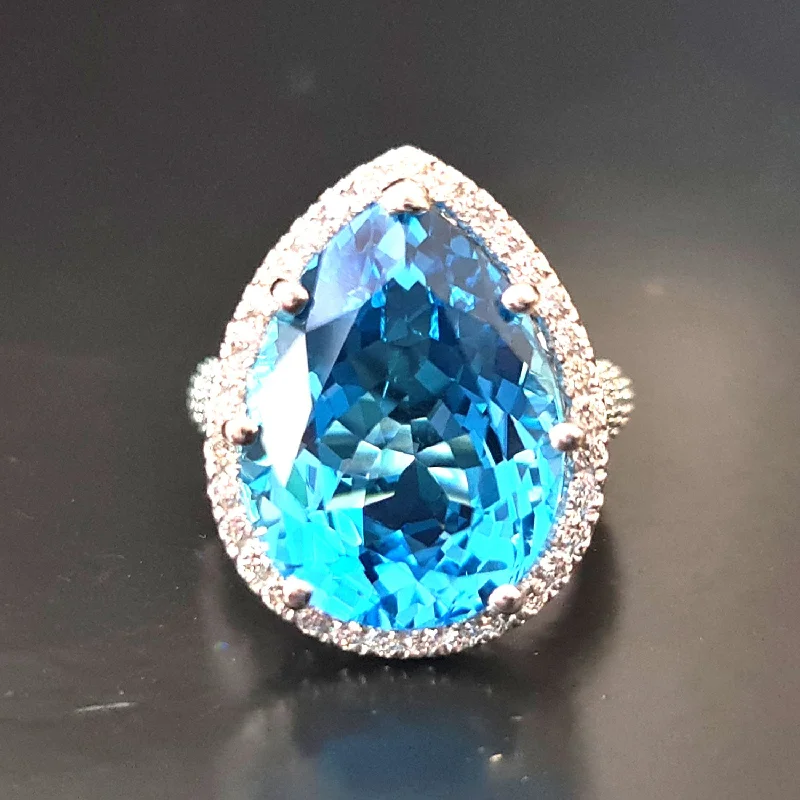 Brianna - 18.00 carat natural swiss blue topaz ring with 1.20 carat diamonds